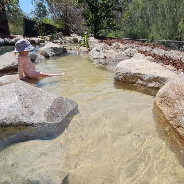 eco billabong with toddler at murphys creek camp grounds