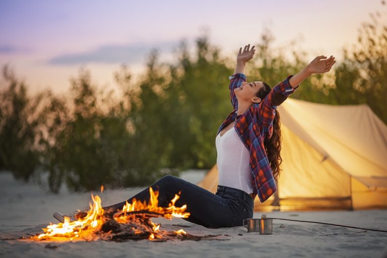 Solo Camper Woman in the Camp Near Campfire